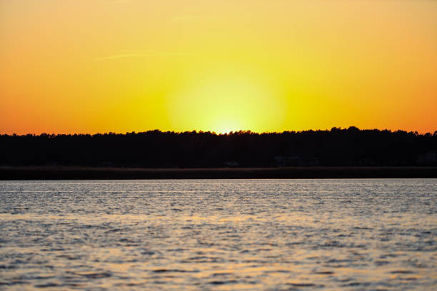 istock Yellow sunset view on late evening near river Lielupe. 1218188944