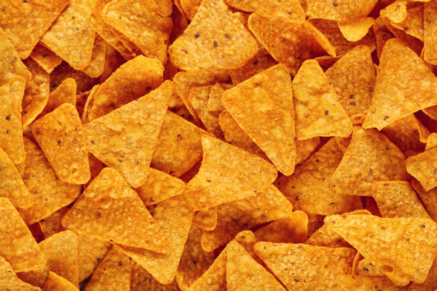 istock Heap of Mexican nachos or tortilla chips as texture background 1218189820