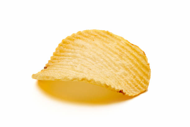 One corrugated or wrinkled potato chip isolated on white background. Close up macro view.