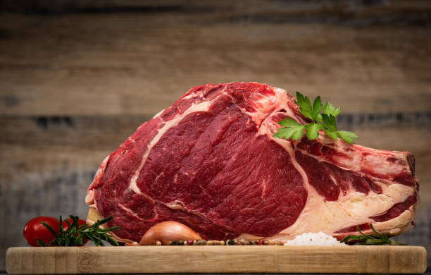 istock Raw T Bone steak on wooden board prepared to Grill 1218194653