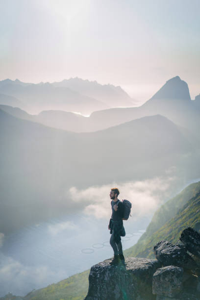 istock Man hiking in mountain on Senja island 1218195474