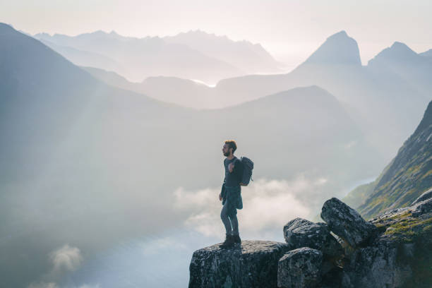 istock Man hiking in mountain on Senja island 1218195475