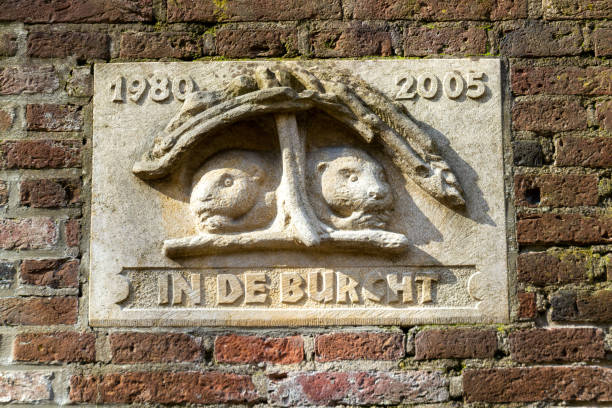Utrecht, the Netherlands - 16 Mar, 2020: Sculpured stone in the wall of the Oudegracht canal in Utrecht