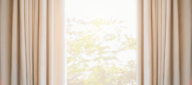 cortina marrón suave con luz de la mañana desde el fondo del dormitorio de la ventana - full frame close up brown day fotografías e imágenes de stock