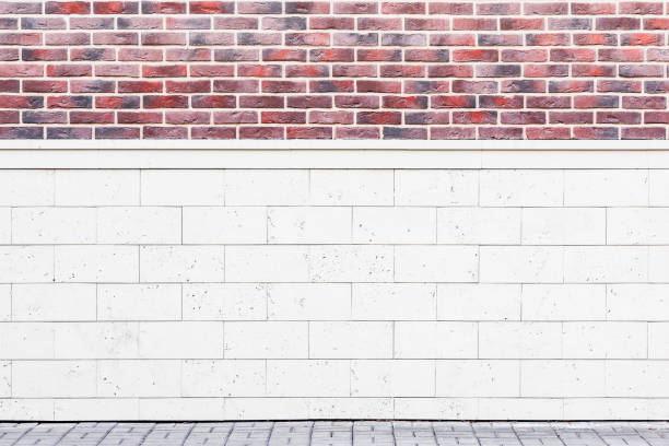 istock Red brick and stone wall with gray stone floor. 1218196874