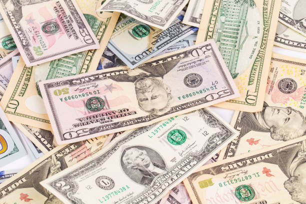 istock Background of different dollar bills. 1218196886