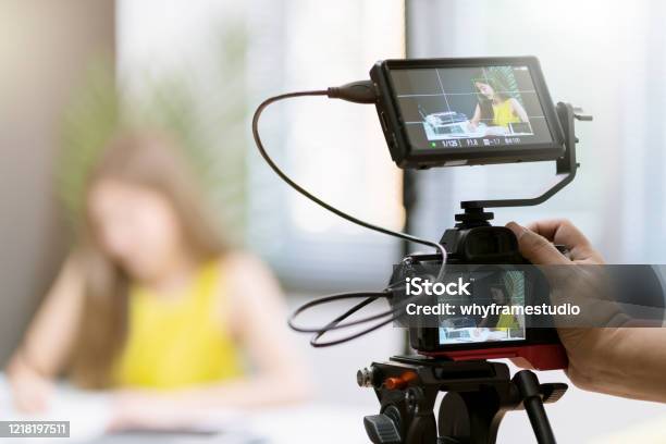 Close Up Camera Gear Shooting Attrative Asian Female Business Woman Yellow Casual Dress Enjoy Working Routine With Laptop Office Background Stock Photo - Download Image Now