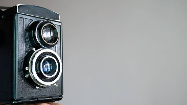 istock Vintage photo camera isolated on white background. Copy space for text. 1218200148