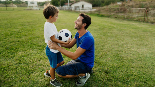 istock Father and son on a soccer court 1218200525