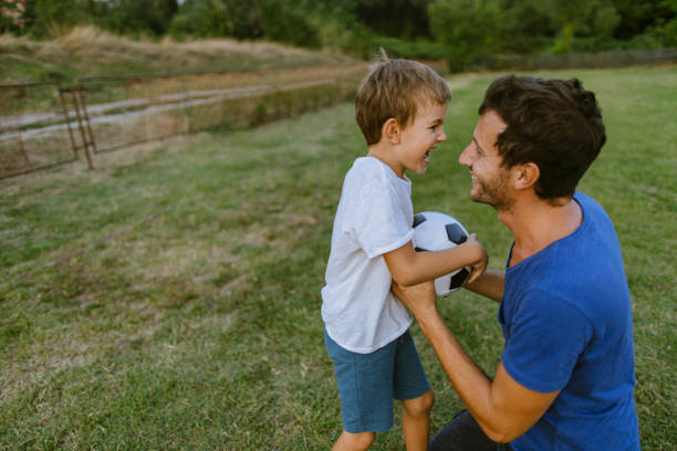 istock Father and son on a soccer court 1218201253