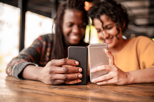 Friends sending money through digital wallet