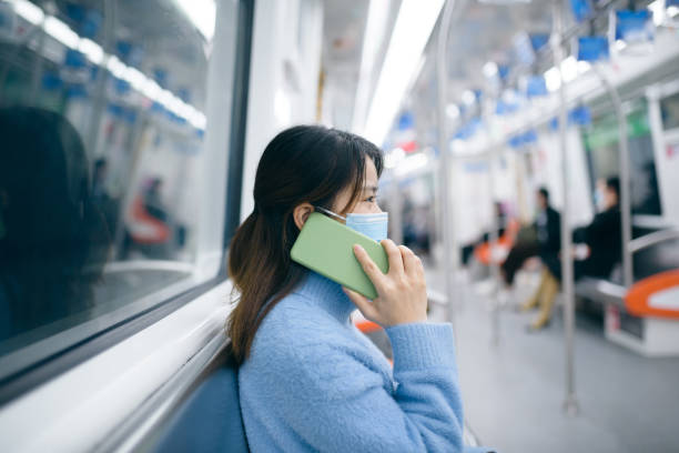 istock A young woman using smart phone in the  subway. 1218204598