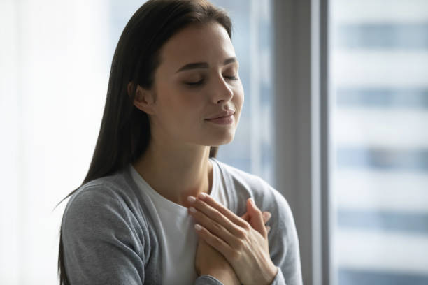 istock Happy millennial woman feel grateful or thankful at workplace 1218204698