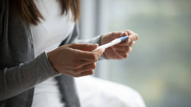 istock Female hold in hands pregnancy ovulation test 1218204734