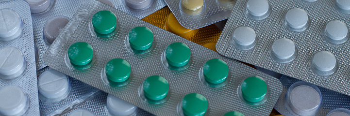 several multi-colored tablets in blisters for the prevention and treatment of diseases