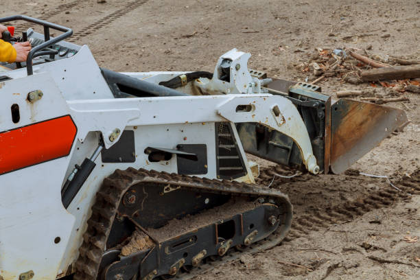 istock Mini bulldozer with earth doing landscaping works 1218206439
