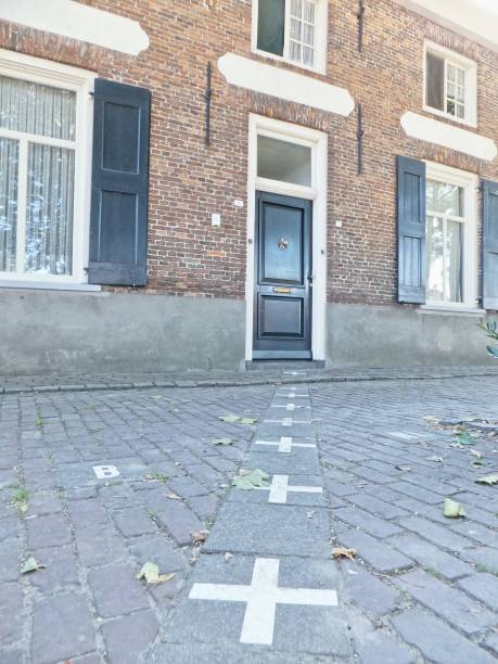 For historical reasons, the village of Baarle is divided into a patchwork of Belgian and Dutch territories. Due to the Schengen Agreement, border crossing is no longer an issue, but the splintered border may cause administrative issues. In addition to depicting the extraordinary peculiarity which makes Baarle a tourist attraction, this image may symbolize European disagreement.