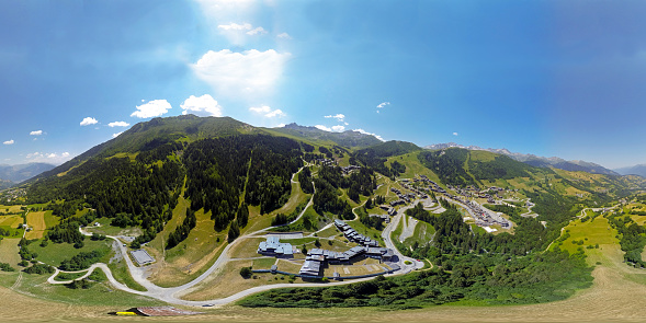 Aerial panorama 360 degrees in Valmorel ski resort, summer time, French Alps.