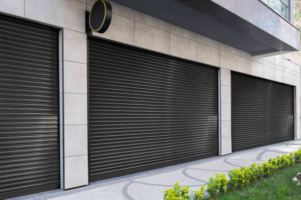 istock Closed Shops black metal roller shutter door. 1218208738