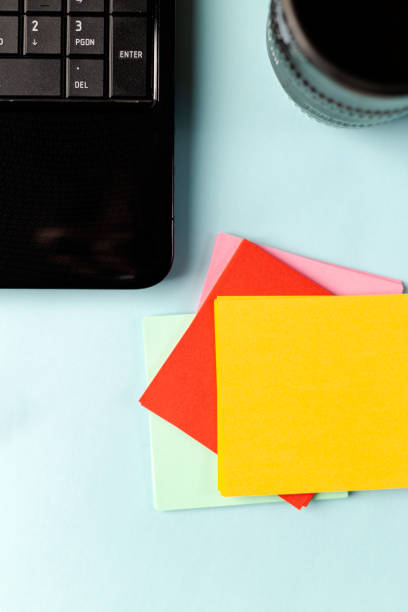 istock Colored Notes papers near a laptop with place for text 1218208785