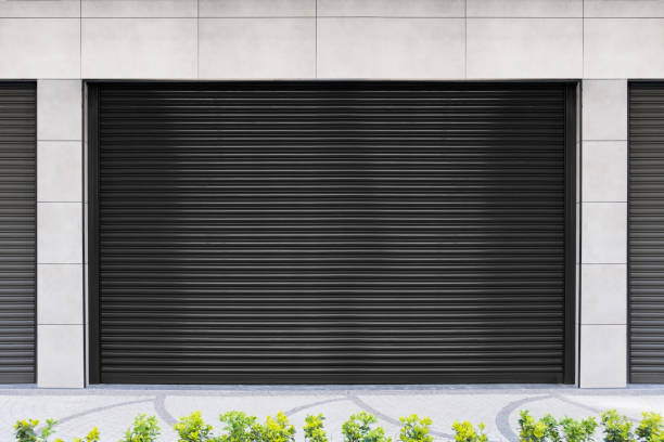 istock Closed Shops black metal roller shutter door. 1218208795