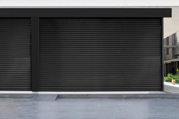 istock Closed Shops black metal roller shutter door. 1218208850