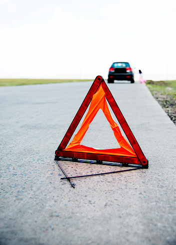 Red triangle sign on the road