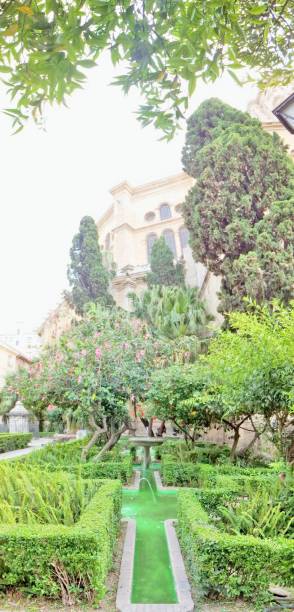 istock Vertical panorama of Malaga cathedral garden 1218209108
