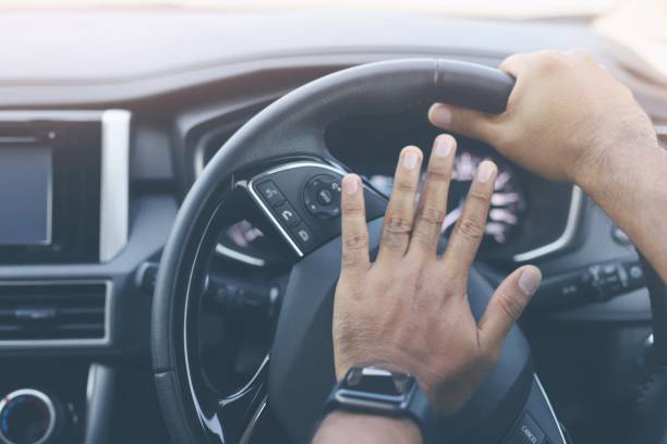 istock The man honk the horn in the car 1218210481