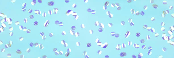 istock Pearl confetti on blue background. 1218212252