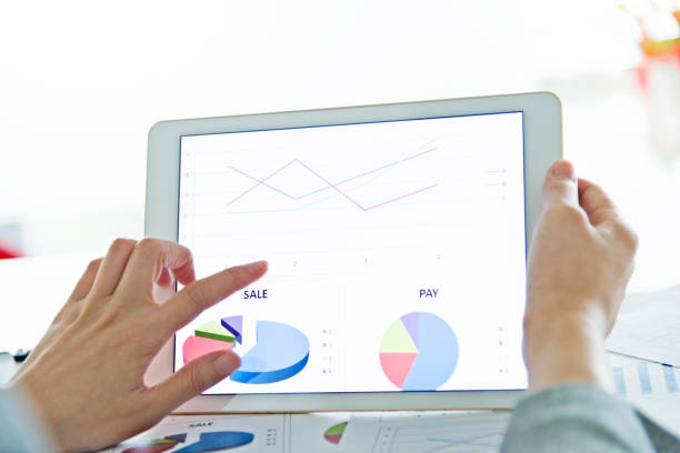 istock Businesswoman holding a digital tablet working 1218213139