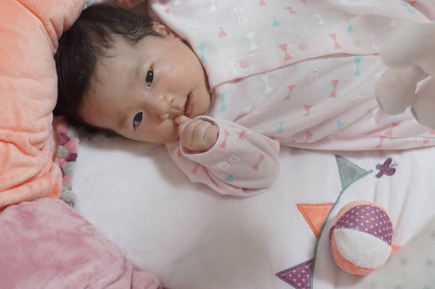 istock baby playing in the baby gym 1218213264