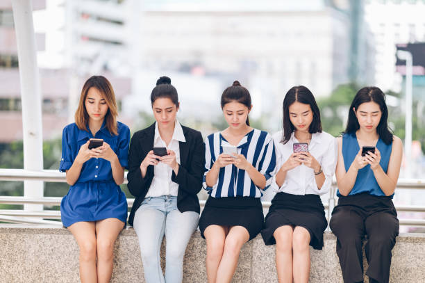 istock Group Asia women using smartphone and checking information on phone 1218213345