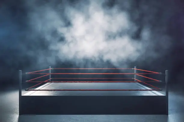 Empty boxing ring in foggy interior. Sport and challenge concept. 3D Rendering