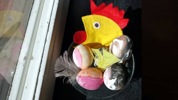istock Eggs painted with a cloth hen in the background to wish everyone happy Easter 1218214576