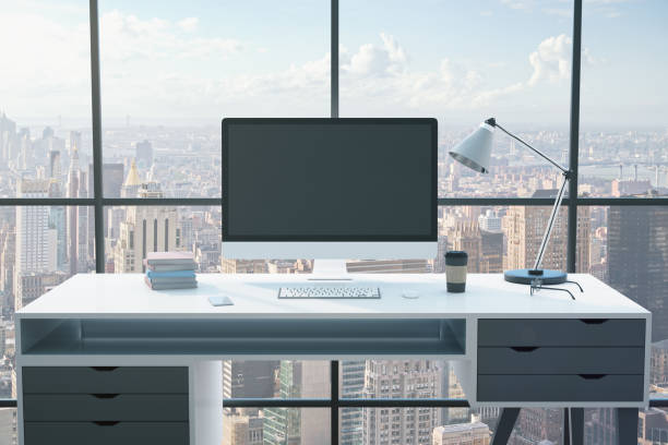 istock Blank black computer monitor screen on table 1218214953