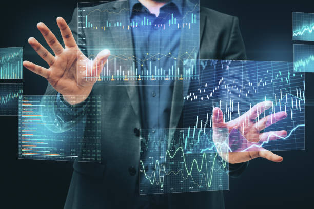 istock Businessman using business chart hologram 1218216019