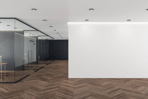 istock Coworking office interior with blank white wall. 1218216110