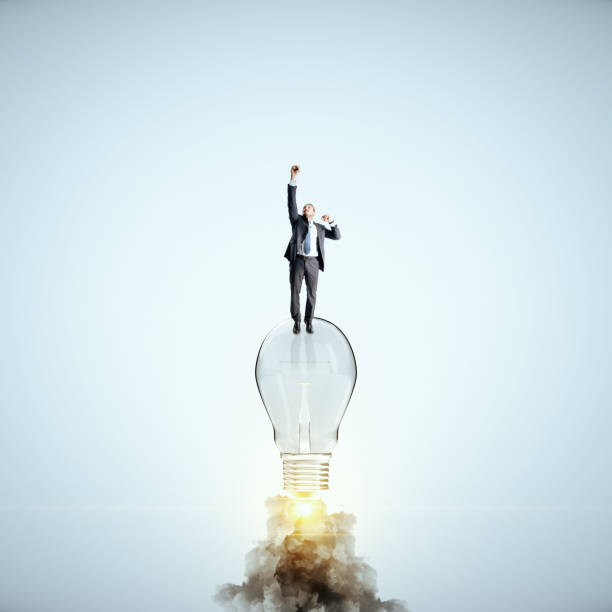 istock Businessman flying with launching lamp 1218216526