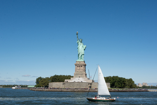 Wideview of Statue of Liberty against the blue sky, New York