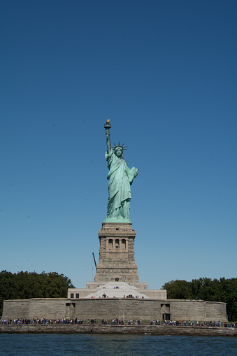 The Statue of Liberty against the blue sky, New York