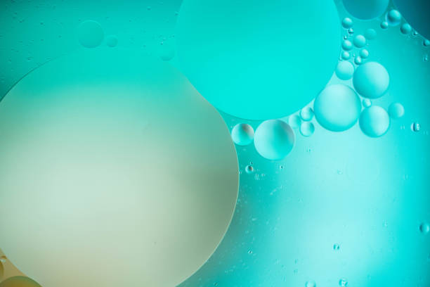 istock oil drop on water for modern and creation colorful background. 1218217823