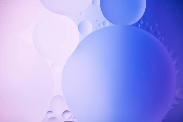 istock oil drop on water for modern and creation colorful background. 1218218070