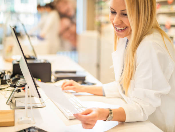 istock Happy pharmacist prescribing a medicine. 1218218111