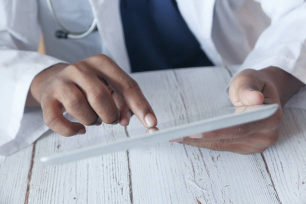 istock Close up of doctor hand use digital tablet 1218218960