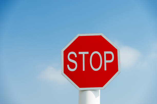istock Stop traffic sign under blue sky 1218220299