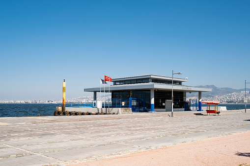 Izmir, Turkey - April 10, 2020: Alsancak steam boat pier is shut and with nobody outside and no travellers because of Coronavirus pandemi. People of is izmir is staying home.