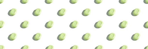 istock Seamless isometric pattern of mint green soap bars on white background, with trendy sunlight and hard shadows. Wash your hands. Body hygiene, protection against bacteria and viruses 1218223563
