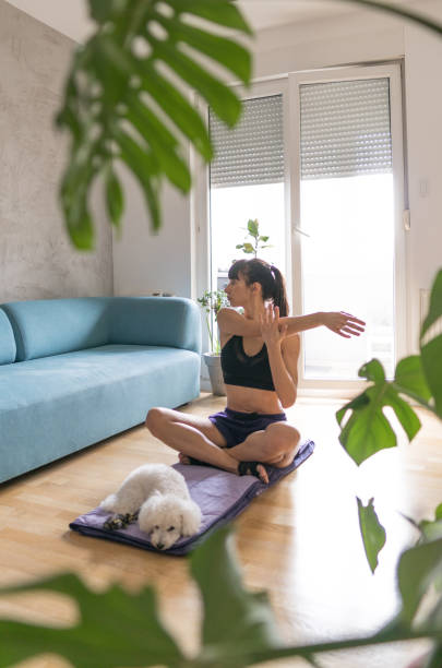 istock Stretching after workout at home during pandemic 1218223604