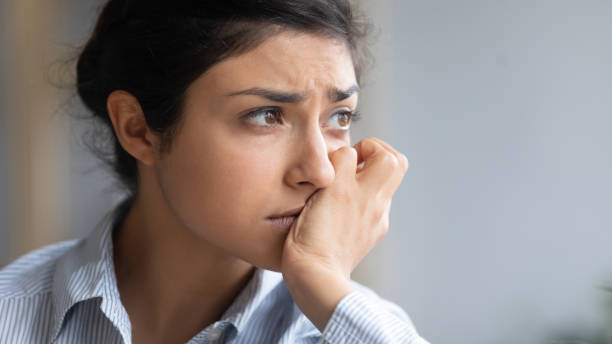 istock Close up depressed unhappy Indian woman thinking about problems 1218223808